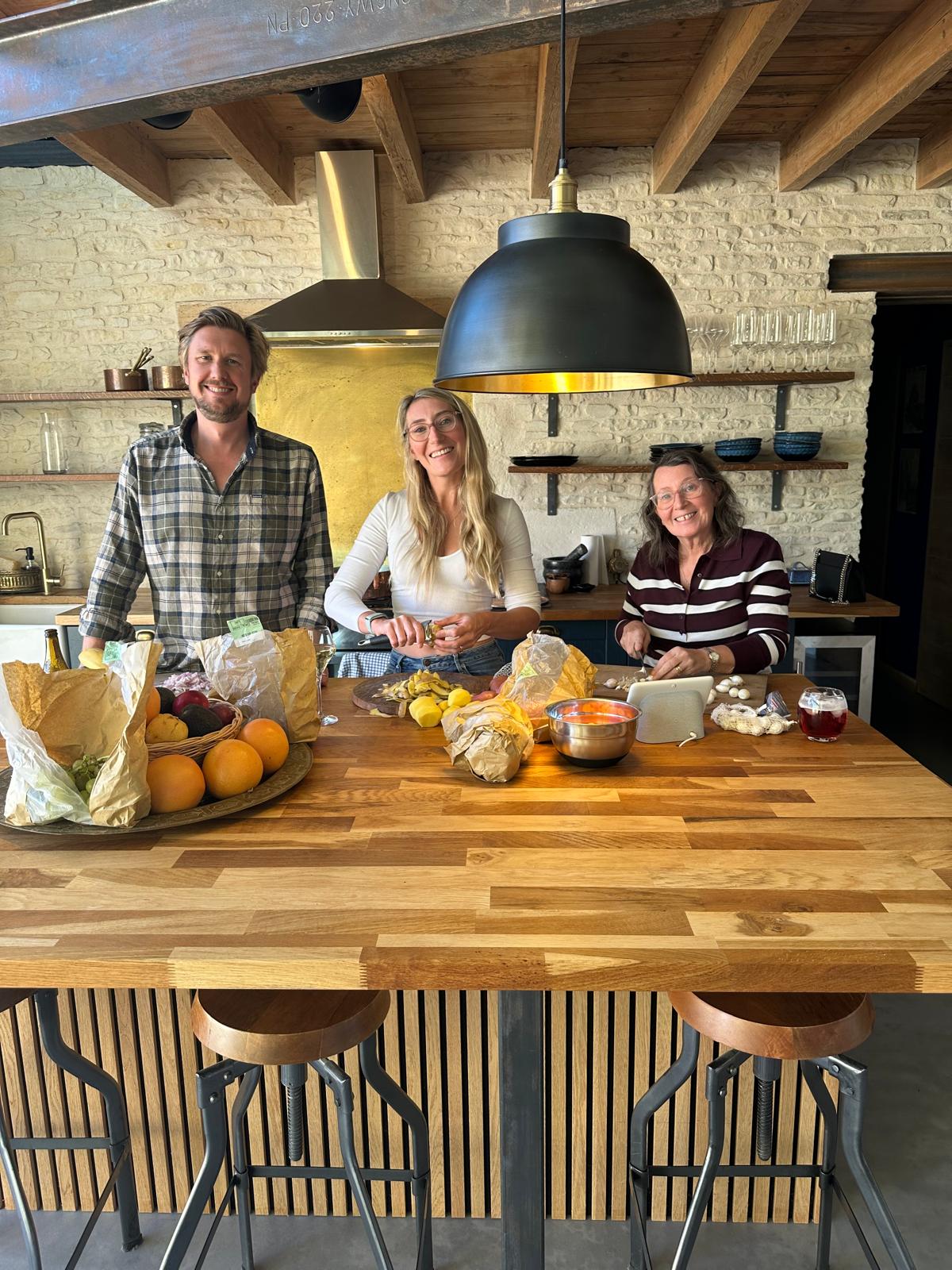 Family gathering enjoying Raclette dinner and cozy evening together in the barn